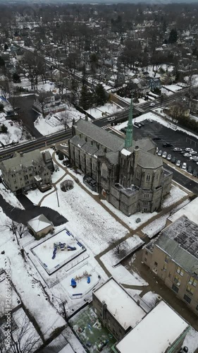 Aerial drone footage of South Jersey in winter, featuring snow-covered rooftops, streets, and urban areas. Capturing the cold season’s atmosphere, this dynamic clip is perfect for real estate, travel,