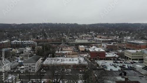 Aerial drone footage of South Jersey in winter, featuring snow-covered rooftops, streets, and urban areas. Capturing the cold season’s atmosphere, this dynamic clip is perfect for real estate, travel,