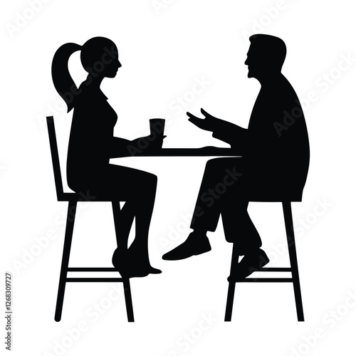A man and a woman are sitting at a table, having a conversation