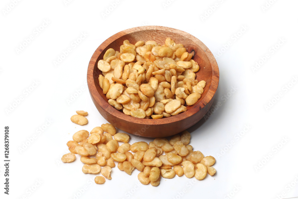 salted broad beans close up in a wooden bowl. top view, good for recipe or commercial, isolated on white background salted broad beans close up in a wooden bowl. top view, good for recipe or commercial, isolated on white background