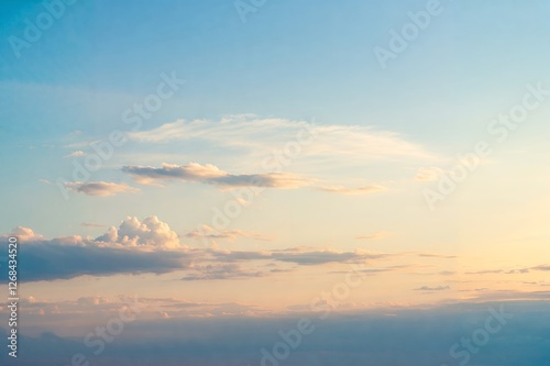 Wallpaper Mural A serene sky with soft, scattered clouds painted in hues of blue and peach, creating a tranquil sunset ambiance. Torontodigital.ca