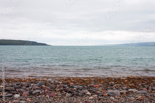 Pebble beach of the Barents Sea, Arctic Ocean. Sredniy Peninsula, Murmansk region, Russia photo