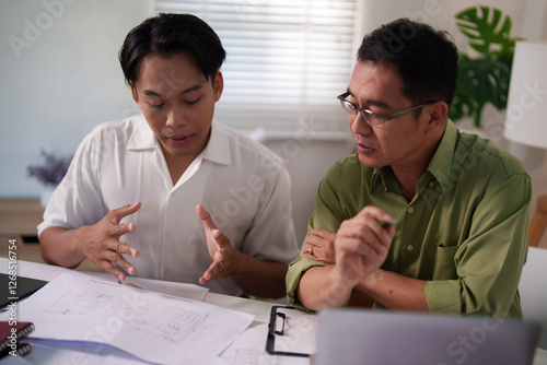 A professional engineering team working on cost estimation and resource allocation for a building project