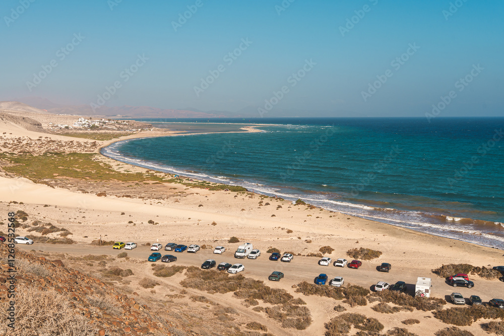 Aerial view of Playa de Sotavento de Jandia in Fuerteventura, showcasing the long sandy beach, turquoise waters, and coastline Aerial view of Playa de Sotavento de Jandia in Fuerteventura, showcasing the long sandy beach, turquoise waters, and coastline