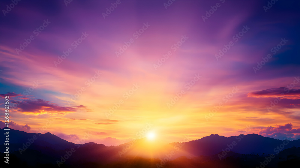 Fototapeta premium Vibrant Sunset Over Silhouetted Mountains