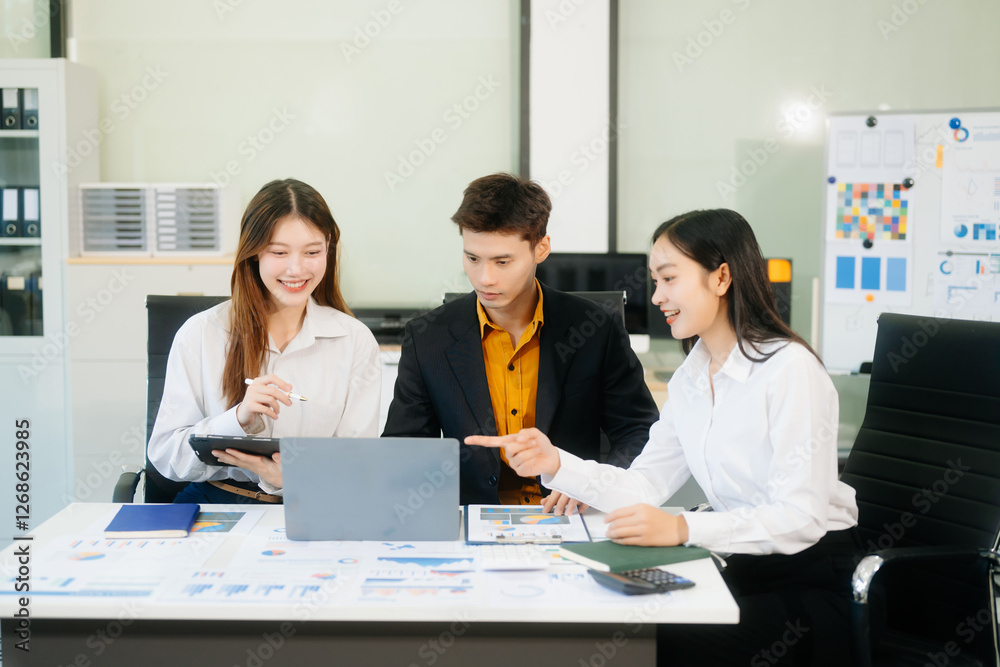 Office colleagues have a casual discussion. During a meeting in a conference room, a group of business teem Office colleagues have a casual discussion. During a meeting in a conference room, a group of business teem