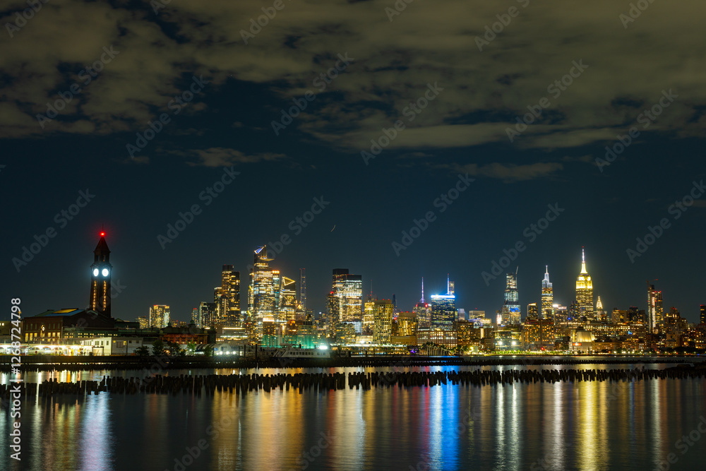 New York City at night. NYC cityscape with skyscrapers. Panoramic of New York City skyline on dusk. Manhattan skyline. New York and Hudson River. Downtown NYC. New York skyscrapers on sunset. New York City at night. NYC cityscape with skyscrapers. Panoramic of New York City skyline on dusk. Manhattan skyline. New York and Hudson River. Downtown NYC. New York skyscrapers on sunset.