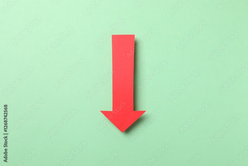 Paper arrow on color background, top view Paper arrow on color background, top view