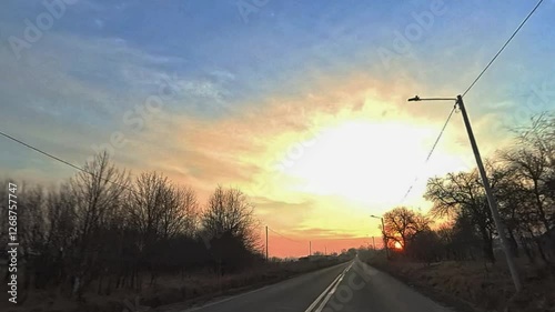 Sunset on the road. Driving on an empty road in the morning.