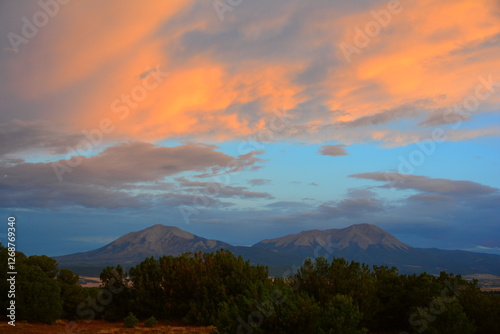 The Spanish Peaks are a pair of prominent mountains located in southwestern Huerfano County, Colorado. The Spanish Peaks were designated a National Natural Landmark in 1976.