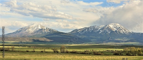 The Spanish Peaks are a pair of prominent mountains located in southwestern Huerfano County, Colorado. The Spanish Peaks were designated a National Natural Landmark in 1976.