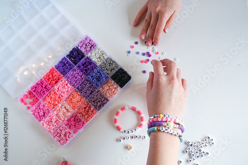 Fotografie Diy jewellery making, friendship bracelets and hands close up.
