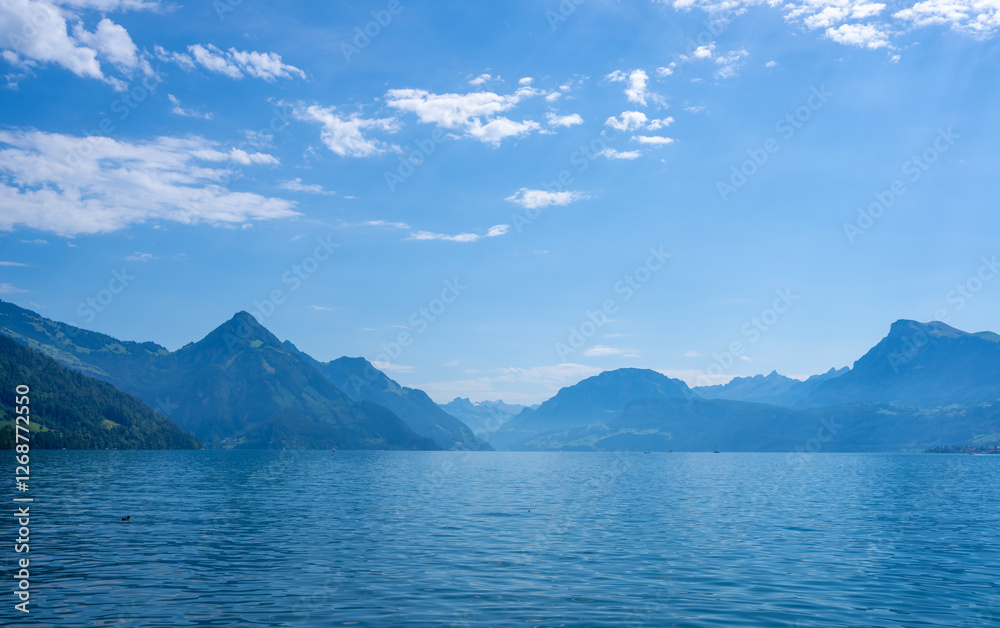 Mountain in the Switzerland in summer, panoramic view with mountain. Switzerland Alps mountains. Alpine mountain scenery. Mountain with lake in Alps. Mountains over the lake and the alps in Mountain in the Switzerland in summer, panoramic view with mountain. Switzerland Alps mountains. Alpine mountain scenery. Mountain with lake in Alps. Mountains over the lake and the alps in