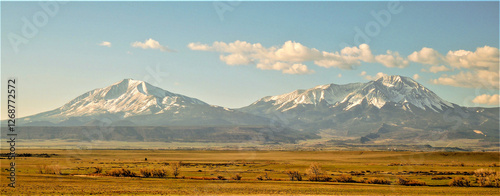 The Spanish Peaks are a pair of prominent mountains located in southwestern Huerfano County, Colorado. The Spanish Peaks were designated a National Natural Landmark in 1976.
