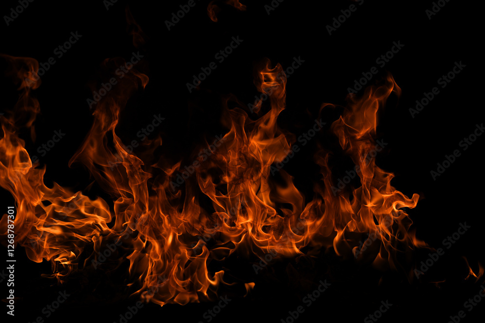 Texture of fire on a black background. Abstract fire flame background, large burning fire. Texture of fire on a black background. Abstract fire flame background, large burning fire.