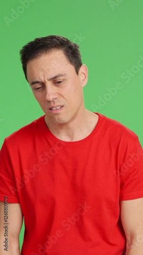 Bipolar man showing different emotions on green screen