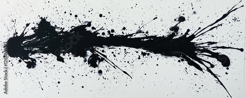 Black ink splash against a white surface, offering a stark contrast ideal for modern designs.
