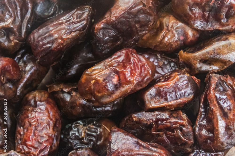Pile of fresh dates.Tropical fruit. Pile of fresh dates.Tropical fruit.
