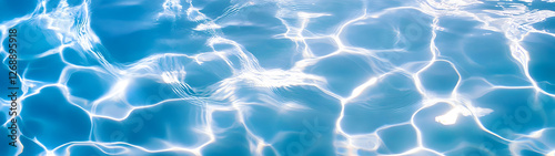 Breathtaking underwater scene showcasing the mesmerizing reflections of shimmering ripples and waves in a vibrant crystal clear blue body of water  A serene and captivating natural backdrop