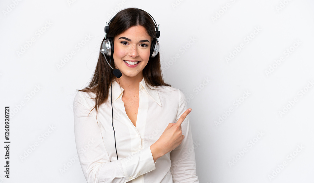 Telemarketer caucasian woman working with a headset isolated on white background pointing to the side to present a product Telemarketer caucasian woman working with a headset isolated on white background pointing to the side to present a product