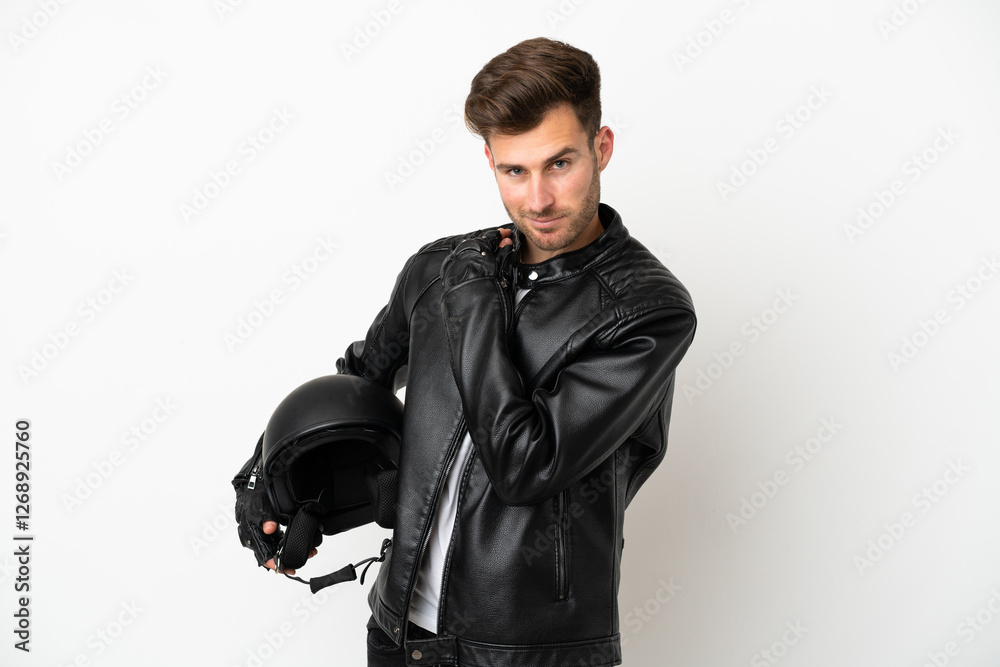 Young caucasian man with a motorcycle helmet isolated on white background laughing Young caucasian man with a motorcycle helmet isolated on white background laughing