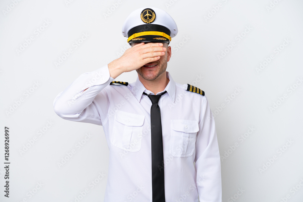 Airplane caucasian pilot isolated on white background covering eyes by hands. Do not want to see something Airplane caucasian pilot isolated on white background covering eyes by hands. Do not want to see something