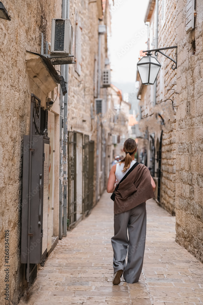 traveler explores charming streets of an ancient city, embracing its rich history and architectural beauty. The warm stone alleys highlight the essence of cultural heritage and timeless exploration traveler explores charming streets of an ancient city, embracing its rich history and architectural beauty. The warm stone alleys highlight the essence of cultural heritage and timeless exploration