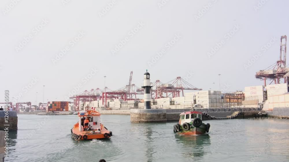 Tugboats navigating busy port: a symbol of maritime trade and logistics Tugboats navigating busy port: a symbol of maritime trade and logistics