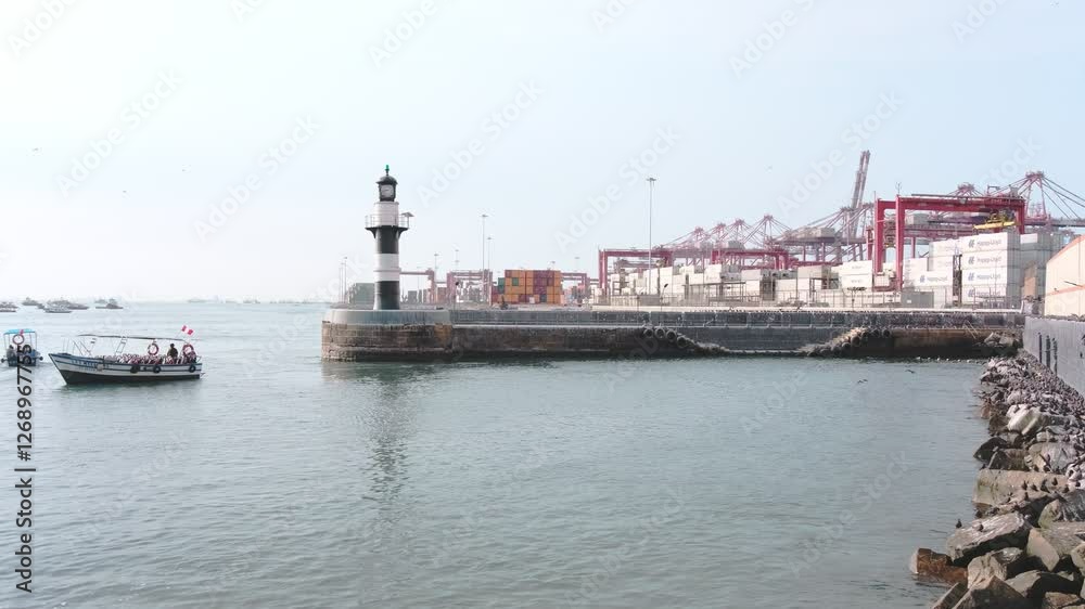 Lighthouse with small boat and harbor in the background Lighthouse with small boat and harbor in the background