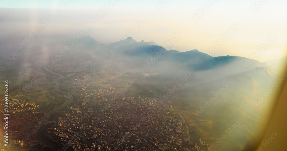 Ulhas river, Mumbai, India. Badlapur is a city in Thane district, Maharashtra state, India, and is a part of Mumbai Metropolitan Region. Aerial View From Airplane Window On View of the Mumbai suburb