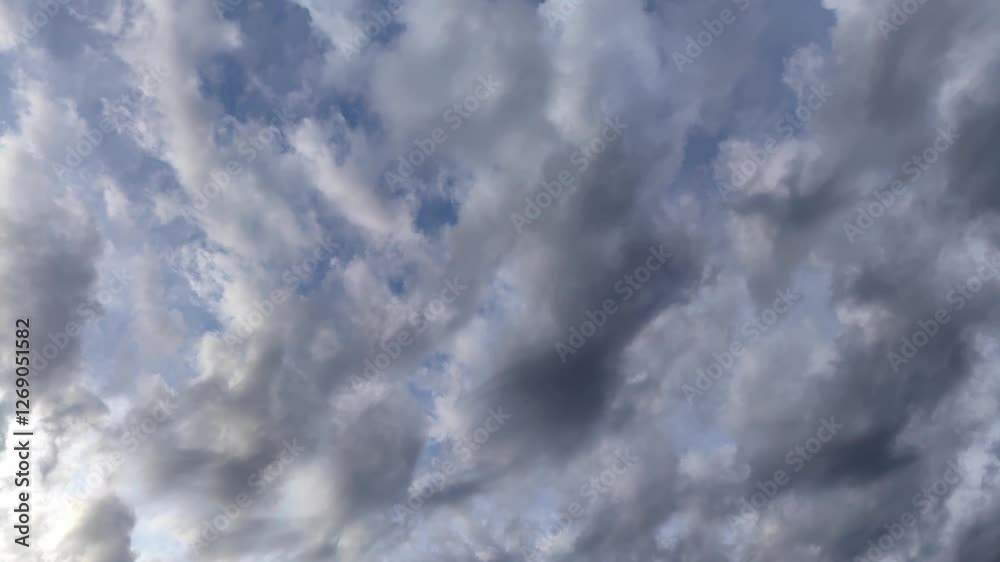 timelapse light fluffy grey clouds moving low across sky after rain. beautiful natural background cloudy sky with copy space. timelapse light fluffy grey clouds moving low across sky after rain. beautiful natural background cloudy sky with copy space.