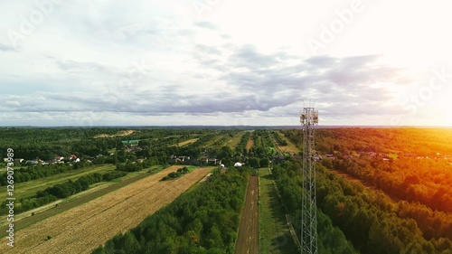 Mobile network antenna tower in open field view