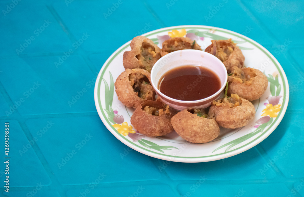 A plate of Fuchka, a popular Bangladeshi traditional street food. A plate of Fuchka, a popular Bangladeshi traditional street food.