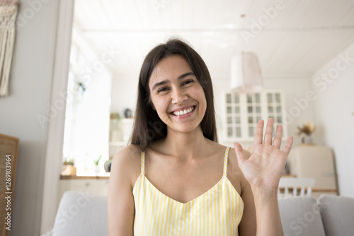Free Download Virtual connection. Webcam screen view portrait beautiful teenage girl make videocall from home sitting on cozy sofa greet friend online wave hand hello hi record vlog shoot content for social media - GFXLoad