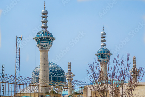 Minarets and main dome of Great Mosalla Mosque against blue sky. Different name is Imam Khomeini Mosalla. Shot in Isfahan, Iran photo