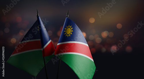 Small flags of the Namibia on an abstract blurry background photo
