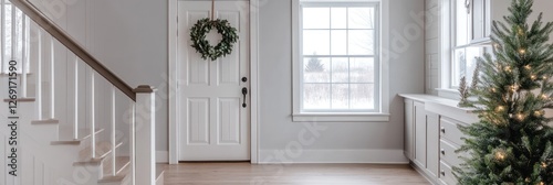 White Entryway with Christmas Tree and Wooden Staircase