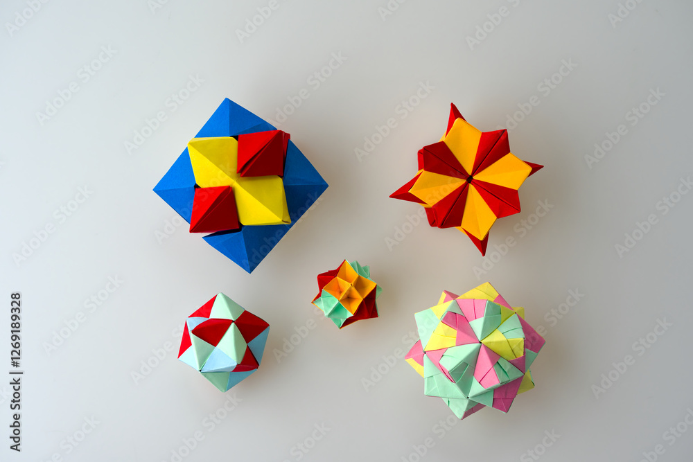 Obraz premium Close-up of colorful origami paper cubes against white background. Photo taken February 16th, 2025, Zurich, Switzerland.