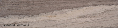 Earthy wooden veneer with natural stripes and organic texture
