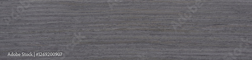 Obraz na płótnie Layers of deep charcoal and subtle slate striations flow seamlessly across this luxurious, dark ash wood veneer surface w salonie