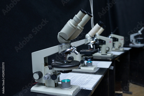 Microscopes set on the worktable of the school lab