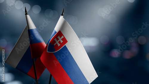 Photography Small flags of the Slovakia on an abstract blurry background