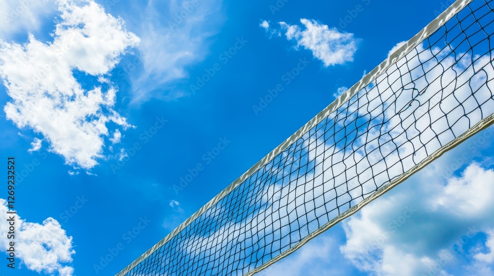 Yellow colored summer games ball against blue sky, beach volleyball or tennis net background for sport events, with ample copy space for branding, promotion, or event advertisements Yellow colored summer games ball against blue sky, beach volleyball or tennis net background for sport events, with ample copy space for branding, promotion, or event advertisements