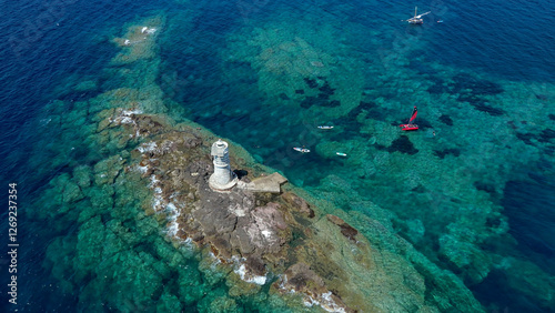 Vista aerea della Secca di Mangiabarche con Faro e Catamarano Rosso photo