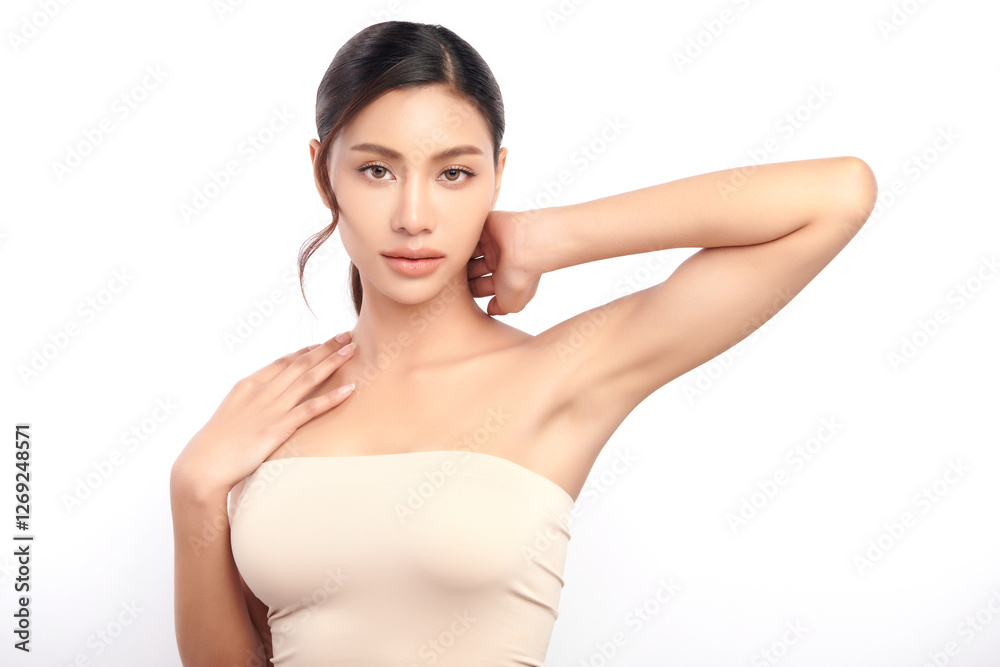 Fototapeta premium Beautiful Young Asian woman lifting hands up to show off clean and hygienic armpits or underarms on white background, Smooth armpit cleanliness and protection concept