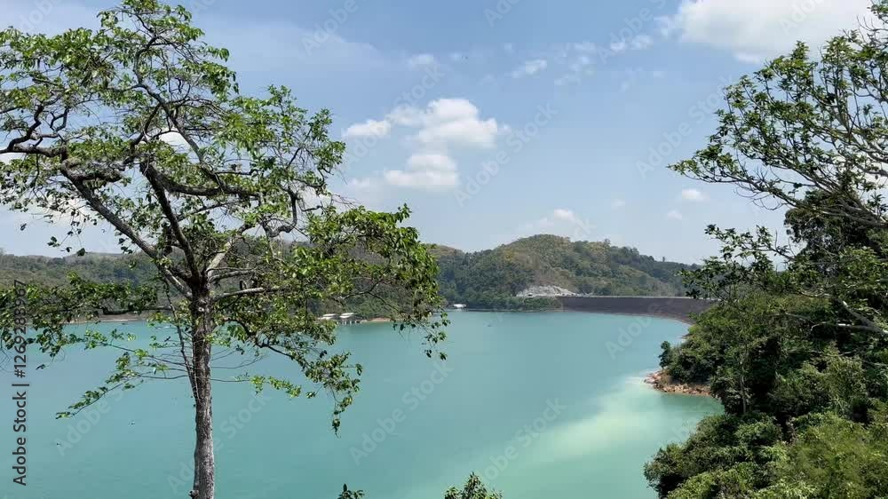 The breathtaking scenery of Cheow Lan Lake in Thailand unfolds with emerald waters, towering limestone cliffs, and lush greenery, creating a serene and majestic atmosphere. The breathtaking scenery of Cheow Lan Lake in Thailand unfolds with emerald waters, towering limestone cliffs, and lush greenery, creating a serene and majestic atmosphere.