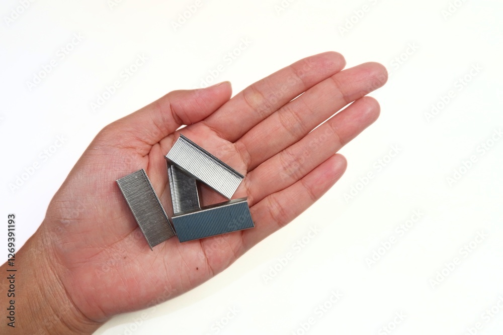 Sharp metal stapler refill on hand Sharp metal stapler refill on hand