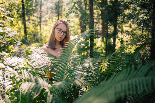 A young woman with glasses ...