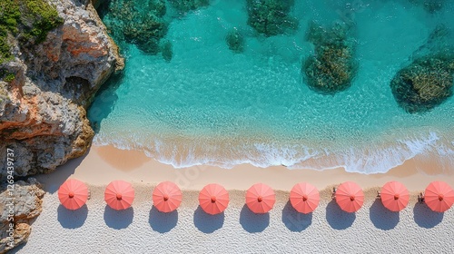 Aerial View of Pink Umbrellas on a Secluded Beach