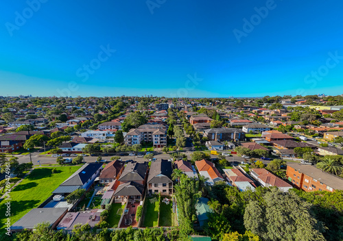 Aerial Drone view looking down on Commercial Suburb of Burwood in Sydney residential houses in suburbia suburban house roof tops and streets park NSW Australia  photo